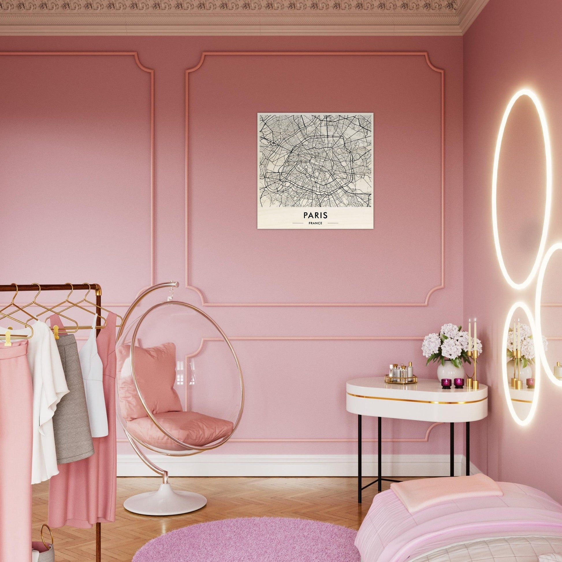 Pink bedroom with feminine decor and a Paris map on the wall.