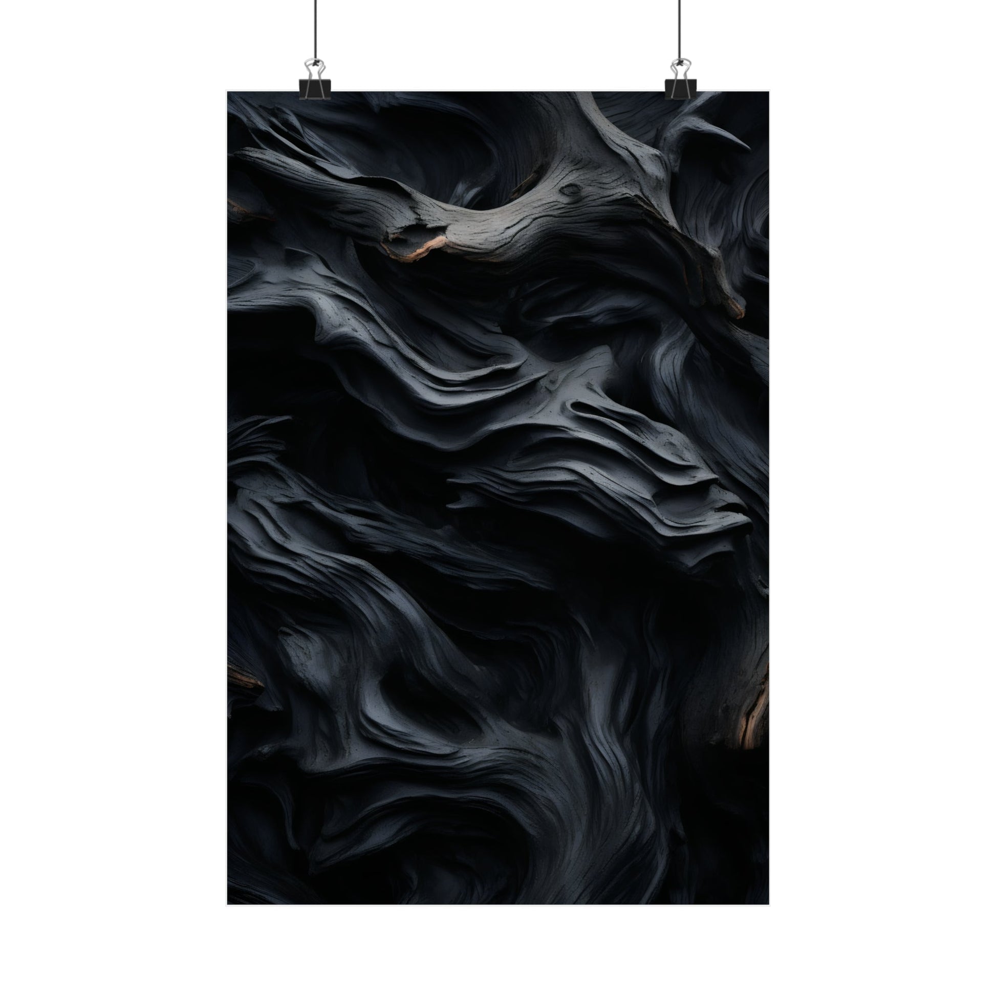 Abstract swirling patterns of dark gray and black resembling smoke or fluid motion.