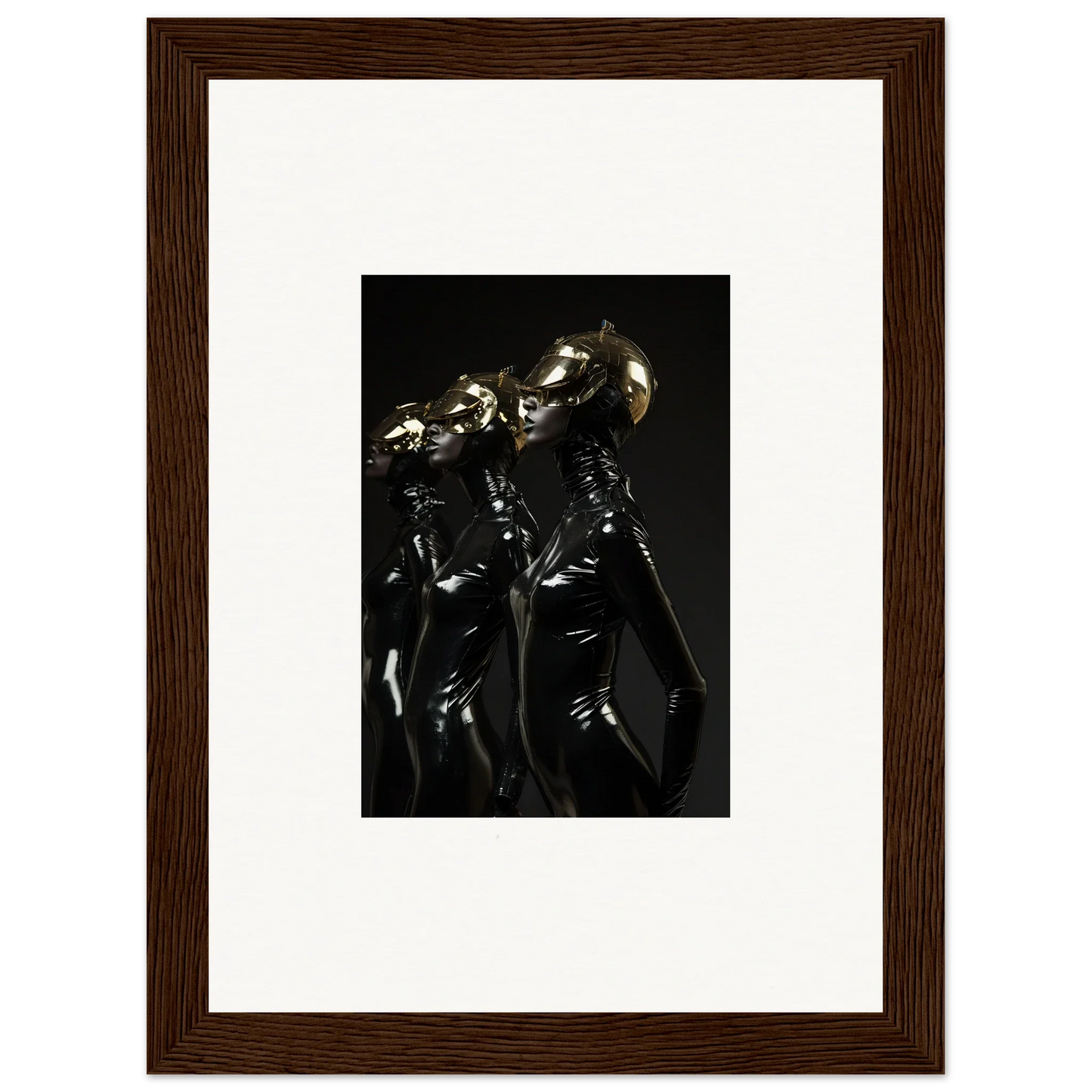 Framed photograph of shiny metallic humanoid figures in dark, sleek outfits.