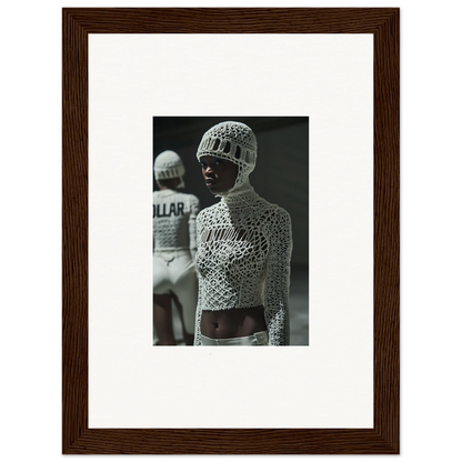 Framed black and white photograph of a person wearing an intricate mesh bodysuit and cap.