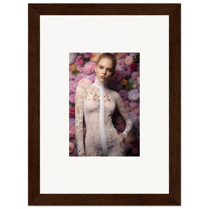 Framed photograph of a woman wearing a white lace dress against a floral background.