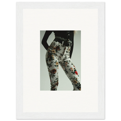 Framed photograph of a person wearing floral-patterned pants or leggings.