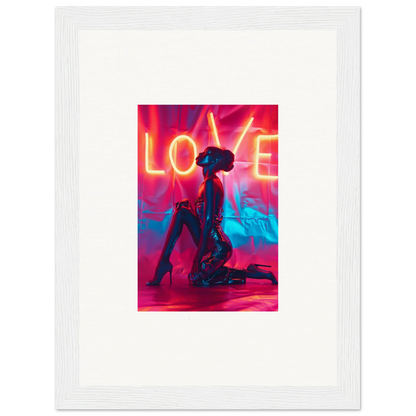 Silhouetted figure kneeling under neon LOVE text, perfect for vibrant wall art decor