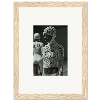 Framed black and white photograph of a boxer wearing an ornate, patterned outfit and headgear.