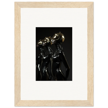 Framed photograph of shiny metallic humanoid figures standing together.