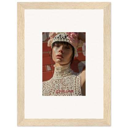 Framed photograph of a person wearing a white crocheted hat and top.