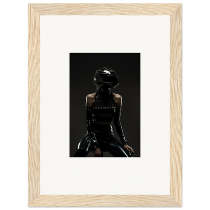 Framed photograph of a person wearing a black helmet and dark clothing, viewed from behind.