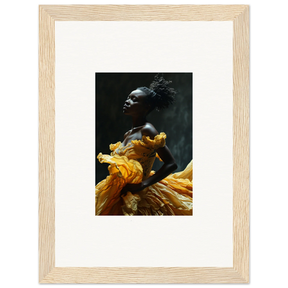 Framed photograph of a person wearing a flowing yellow garment against a dark background.