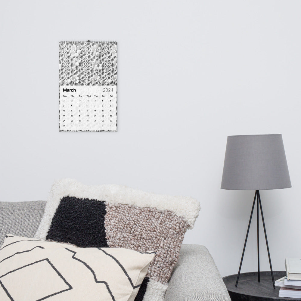 A Crochet Patterns Wall Calendar: A Year-Round Inspiration for Crochet Enthusiasts hanging on a wall in a living room.