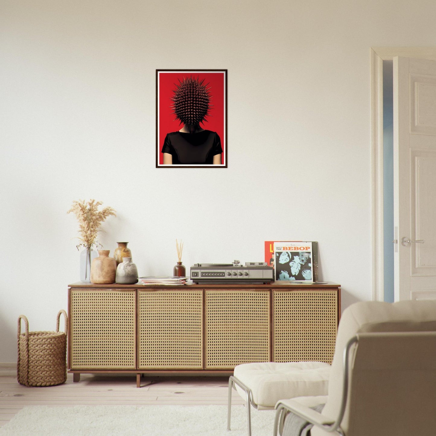 Stylish wooden sideboard with rattan-fronted doors and decorative items on top.