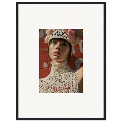 Framed portrait photograph of a person wearing a white crocheted hat and top.