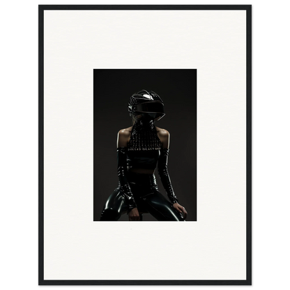 Silhouette of a person wearing a motorcycle helmet and leather outfit.