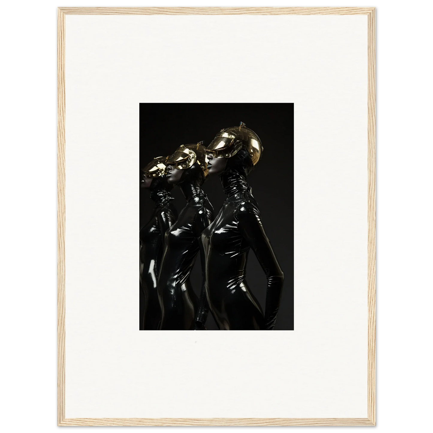 Framed photograph of three figures in shiny black outfits with metallic helmets.