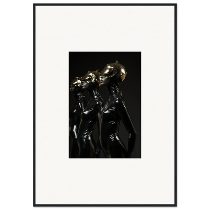 Framed photograph of figures in shiny black outfits with metallic helmets.