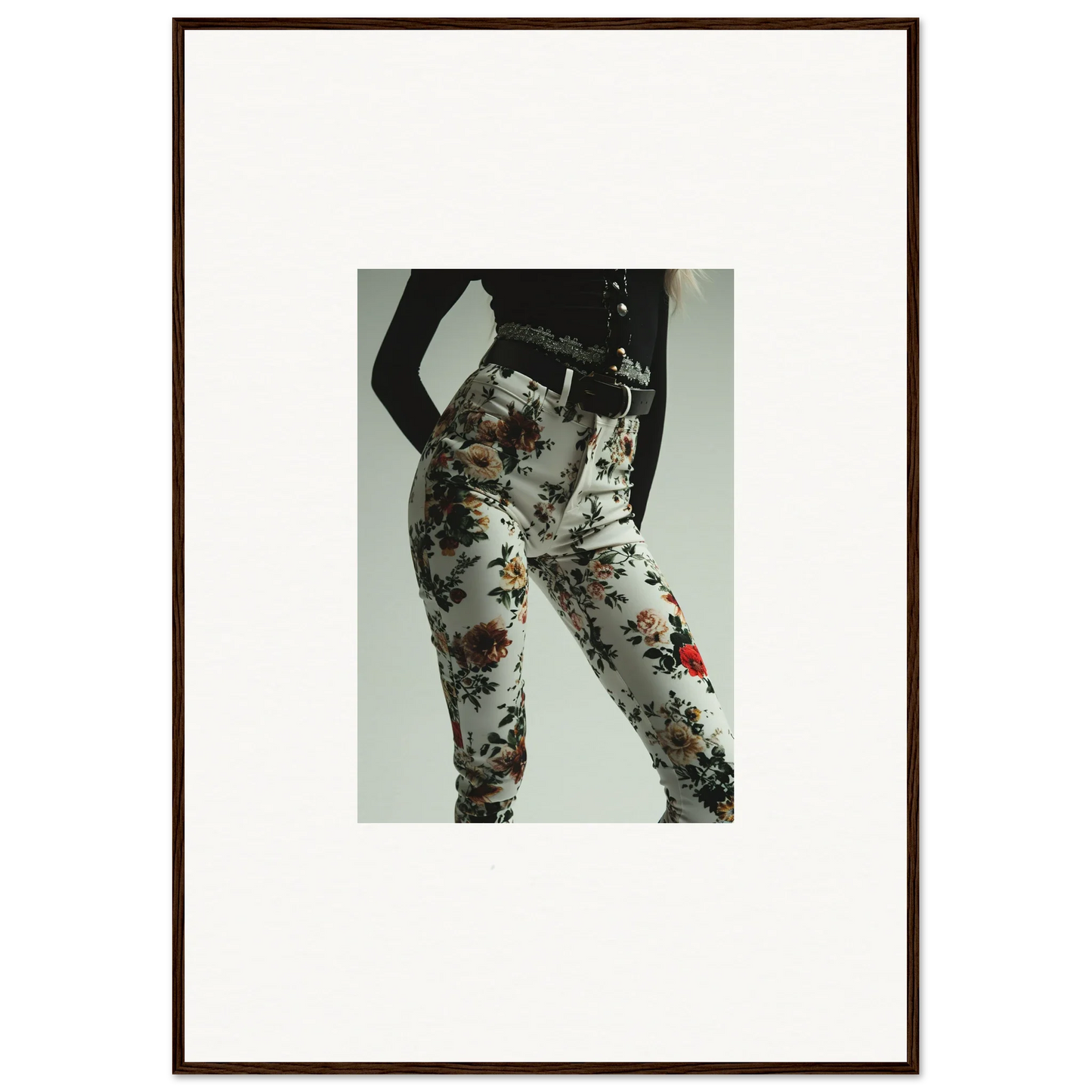 Floral-patterned pants or leggings worn on a person’s lower body.