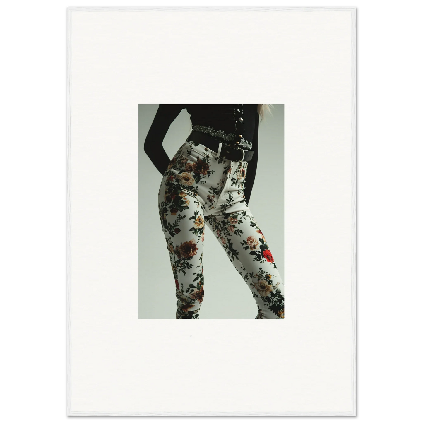 Floral patterned leggings or tight pants worn on a person’s lower body.