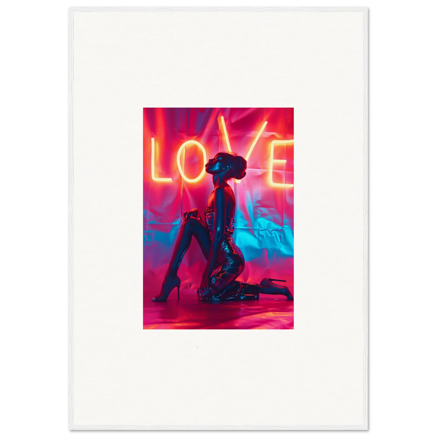 Silhouetted figure kneeling under a vibrant neon LOVE sign perfect for room decoration