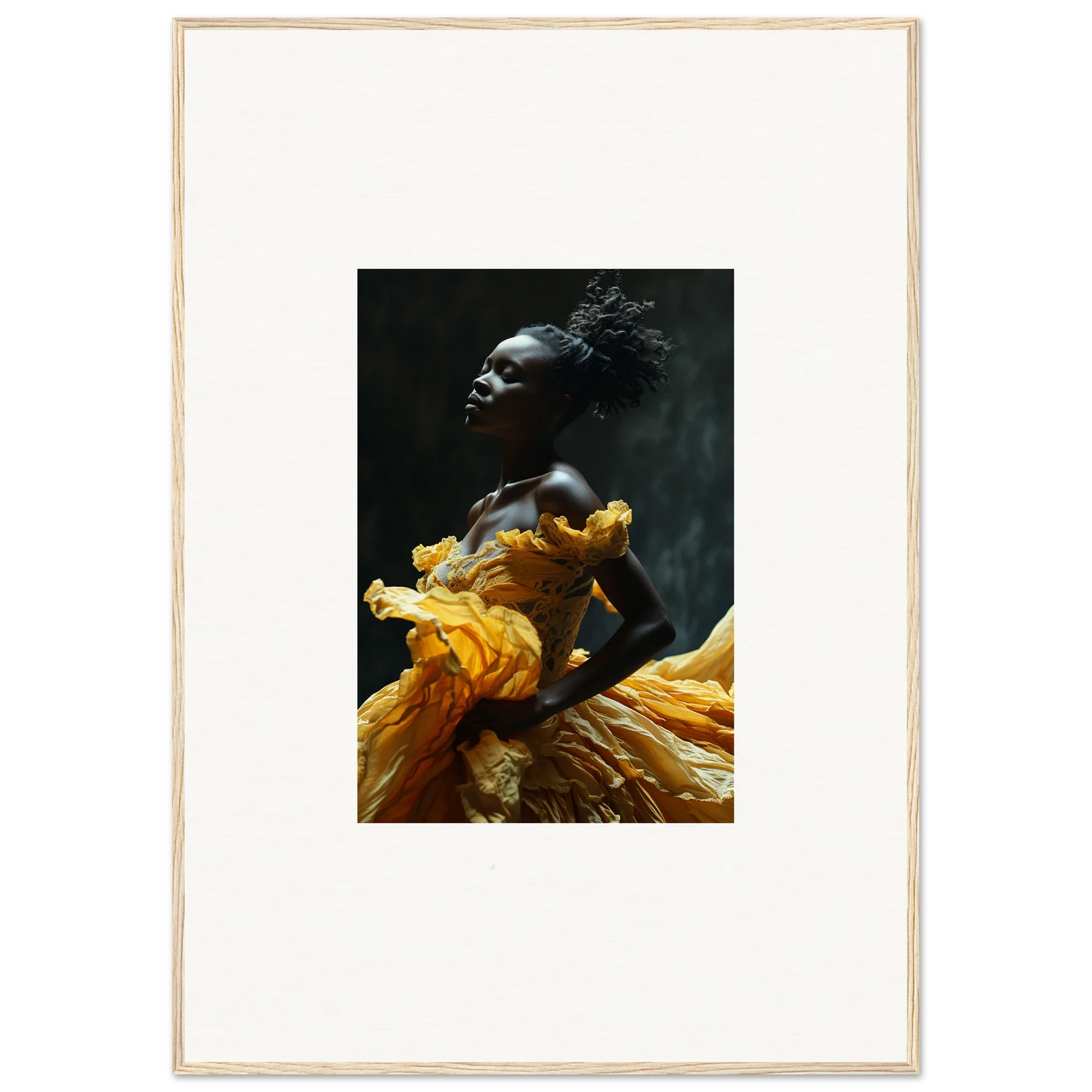 Striking portrait of a person wearing vibrant yellow fabric against a dark background.