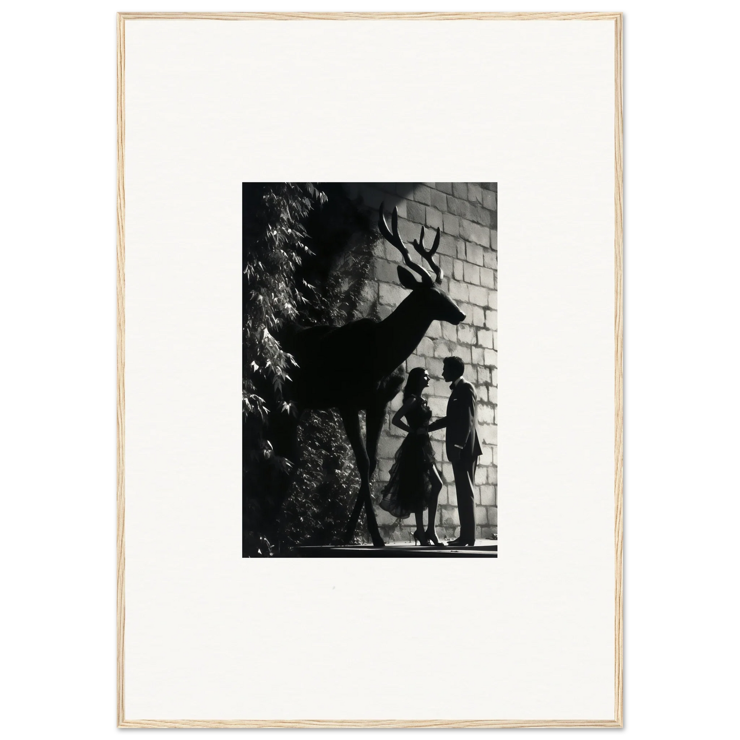 Black and white photograph showing silhouettes of a deer and two people against a brick wall.