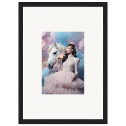 Framed photograph of a woman in a pink tulle dress posing with a white horse against a dreamy sky backdrop.