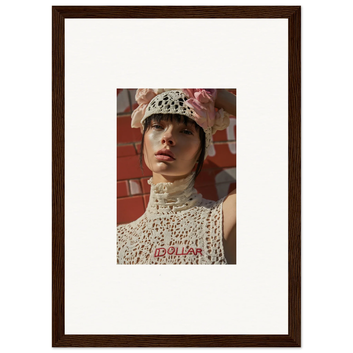 Framed portrait photograph of a person wearing a white crocheted hat and high-necked top.