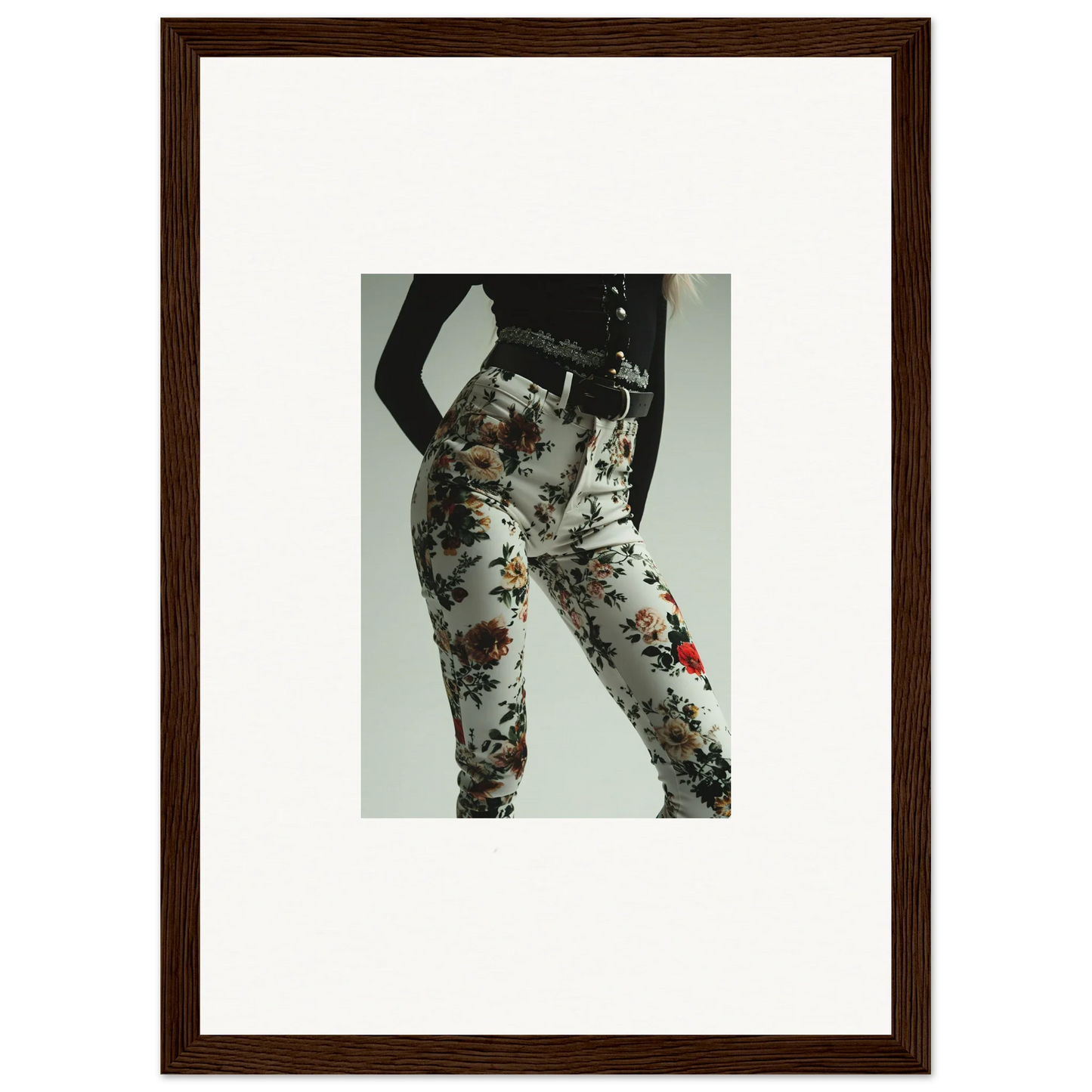 Framed photograph of a person wearing paint-splattered pants.