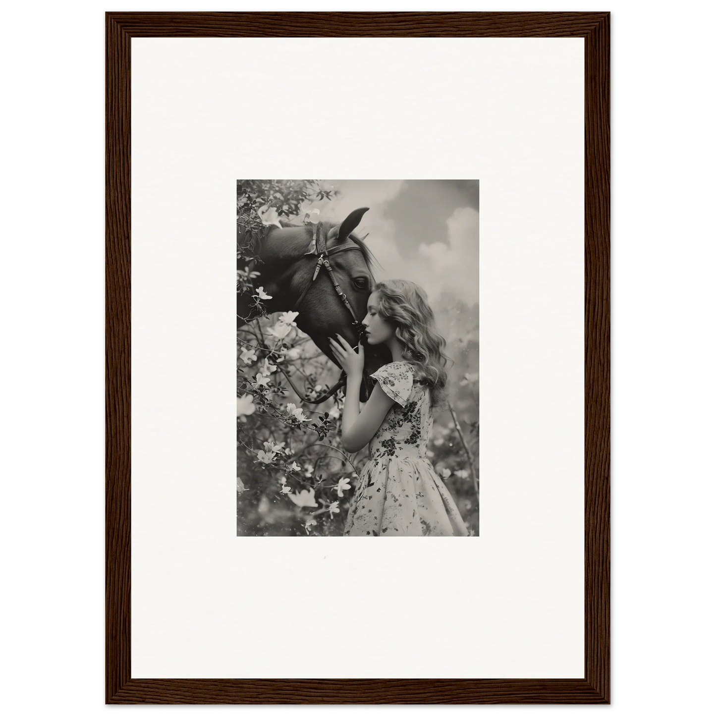 Framed black and white photo of girl smelling flower, perfect for room decoration