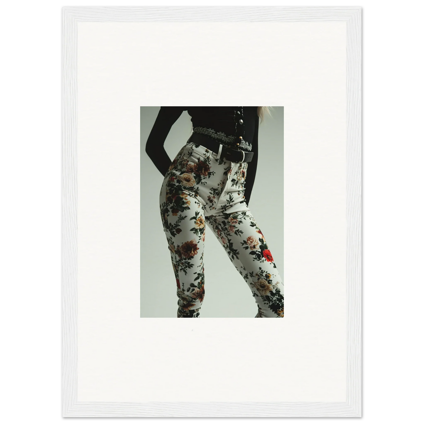 Floral-patterned pants or leggings worn on a person’s lower body.