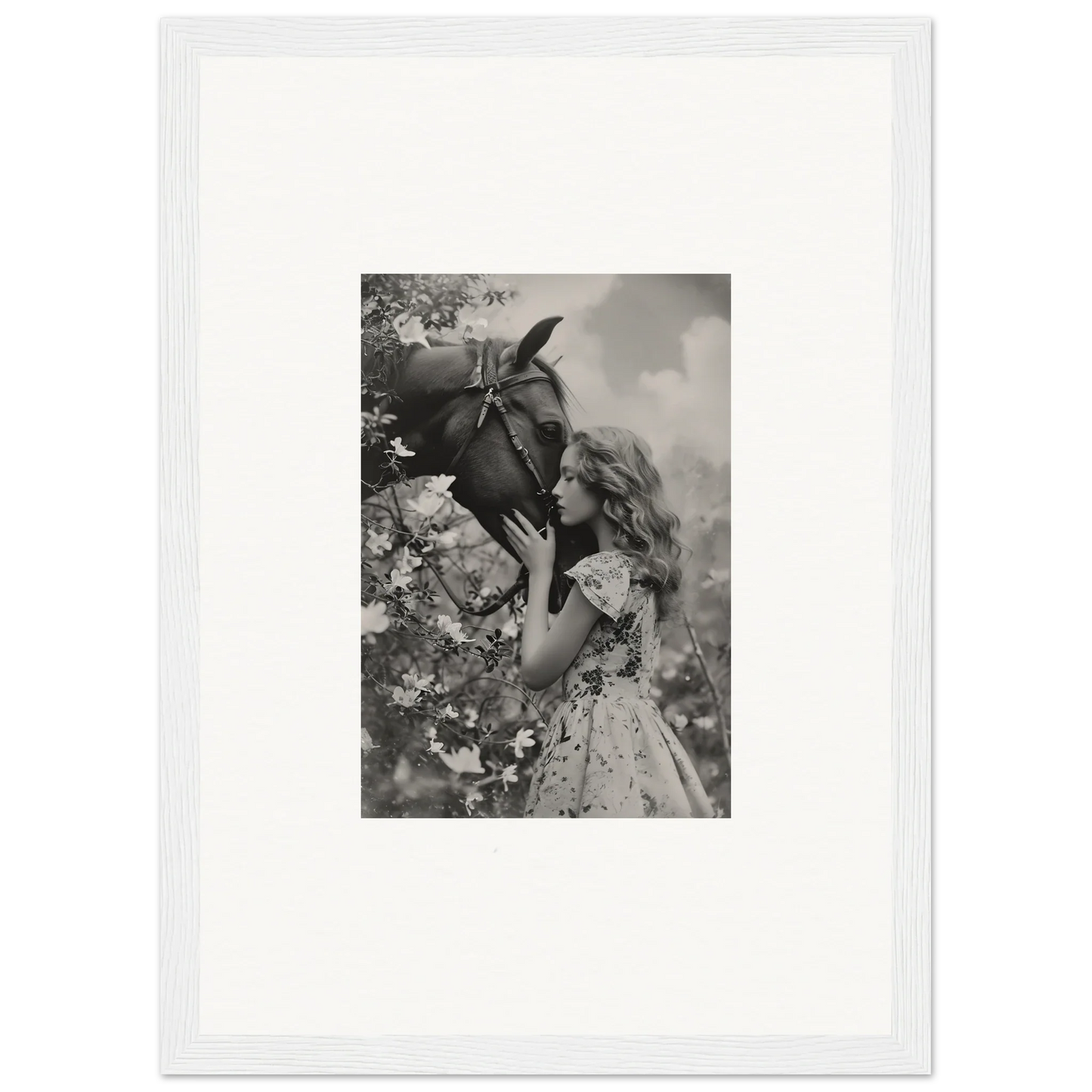 Young girl enjoying a flower in a black and white canvas print for room decoration