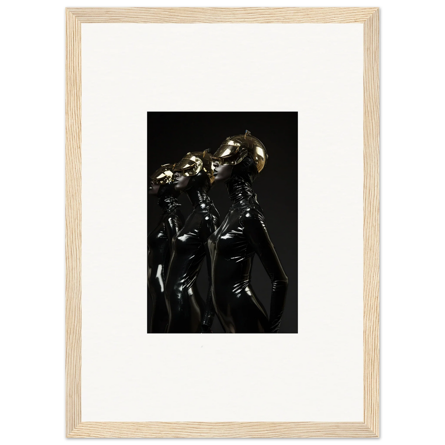 Framed photograph of shiny, metallic humanoid figures in dark, reflective outfits.