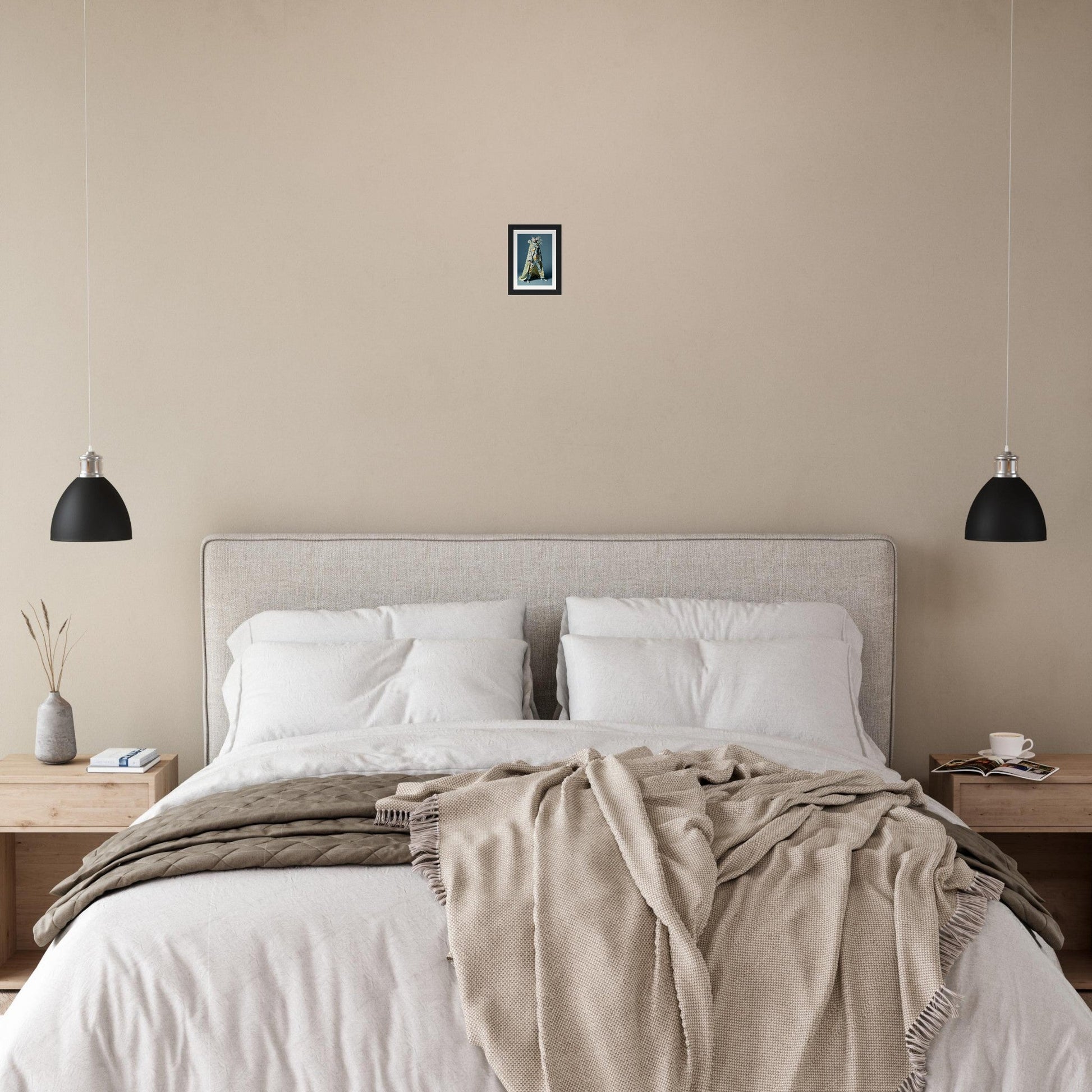 Bed with white pillows and linens, topped by a beige throw blanket.