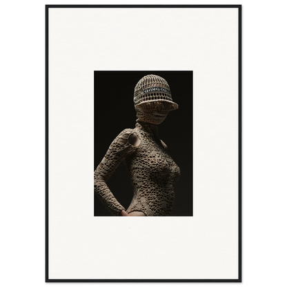 Artistic photograph of a human figure covered in a textured, scale-like pattern wearing a knitted cap.