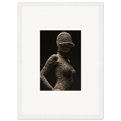 Artistic sculpture of a female figure with textured skin and a patterned hat.