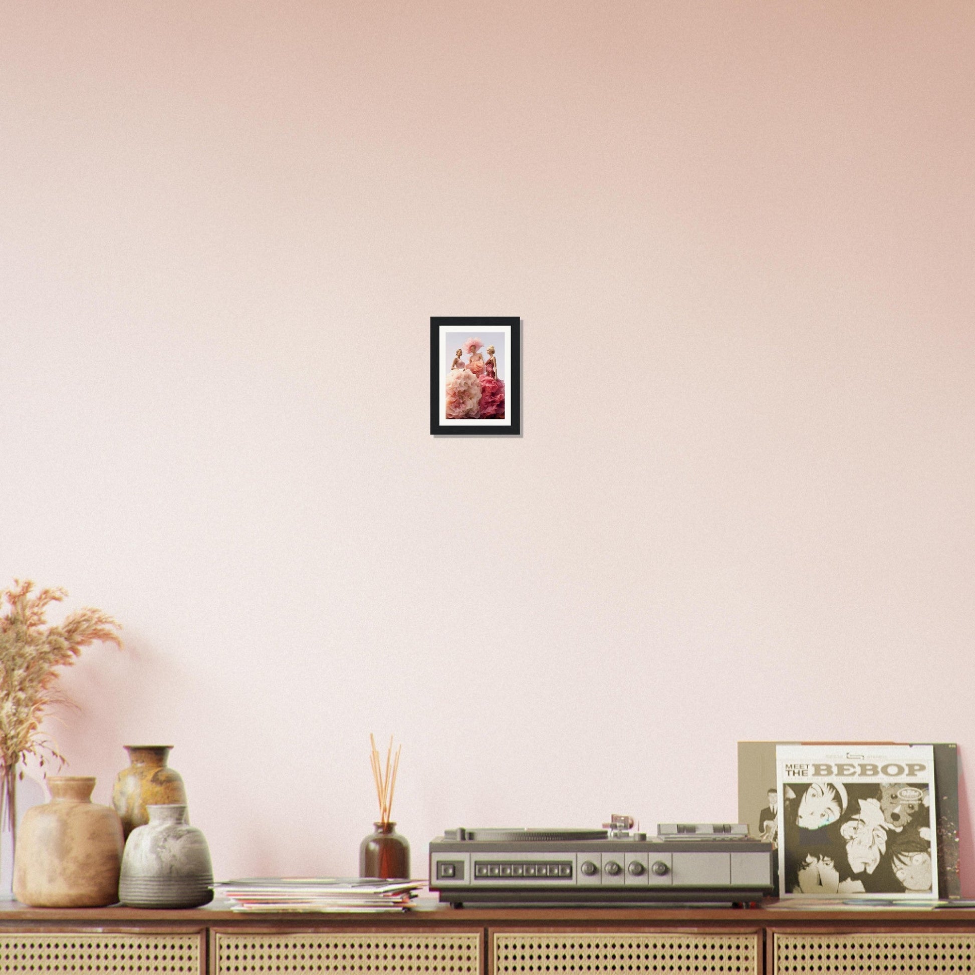 Wooden console table with decorative items displayed on top, including vases, a vintage radio, and framed artwork.