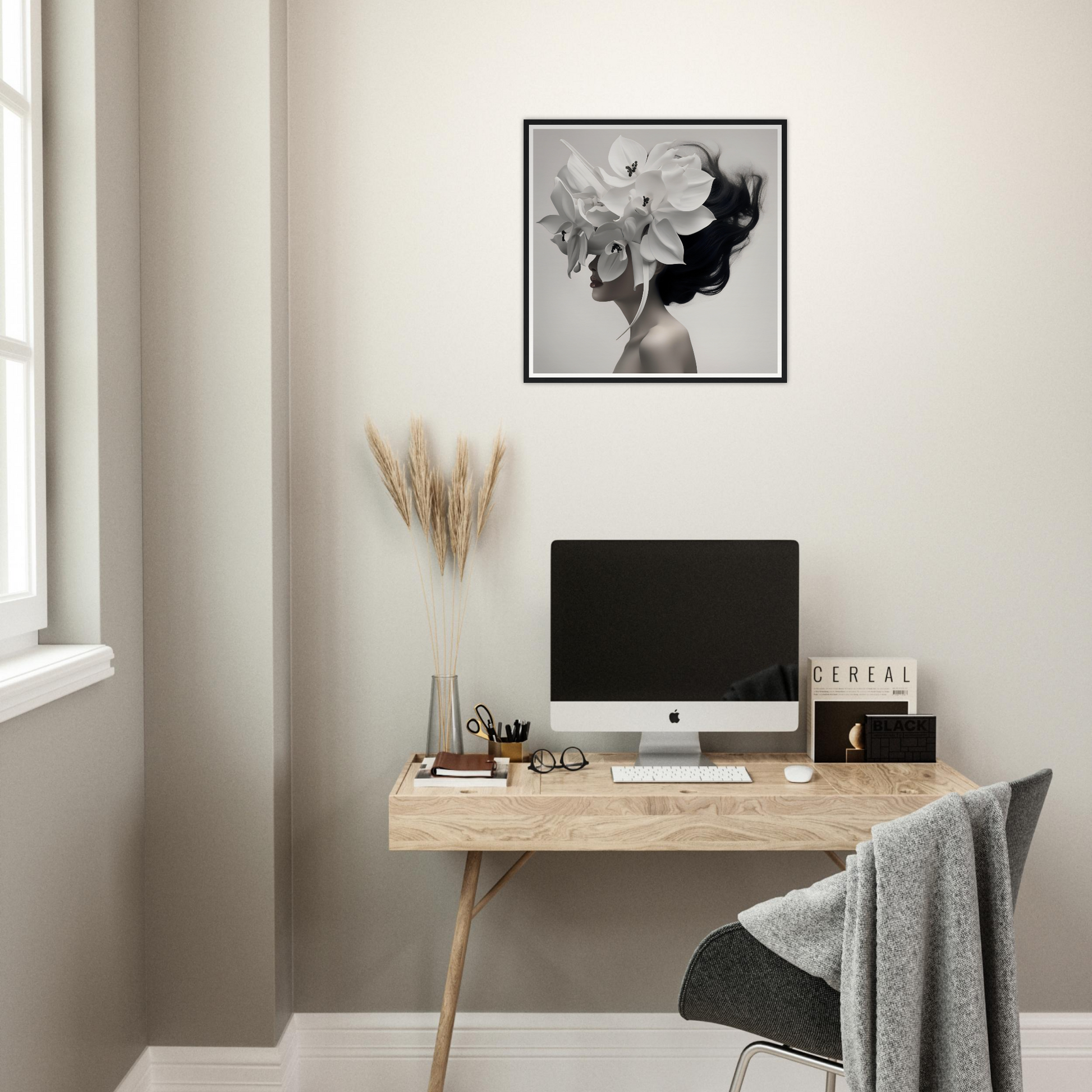 Minimalist wooden desk with a computer monitor and decorative accessories.