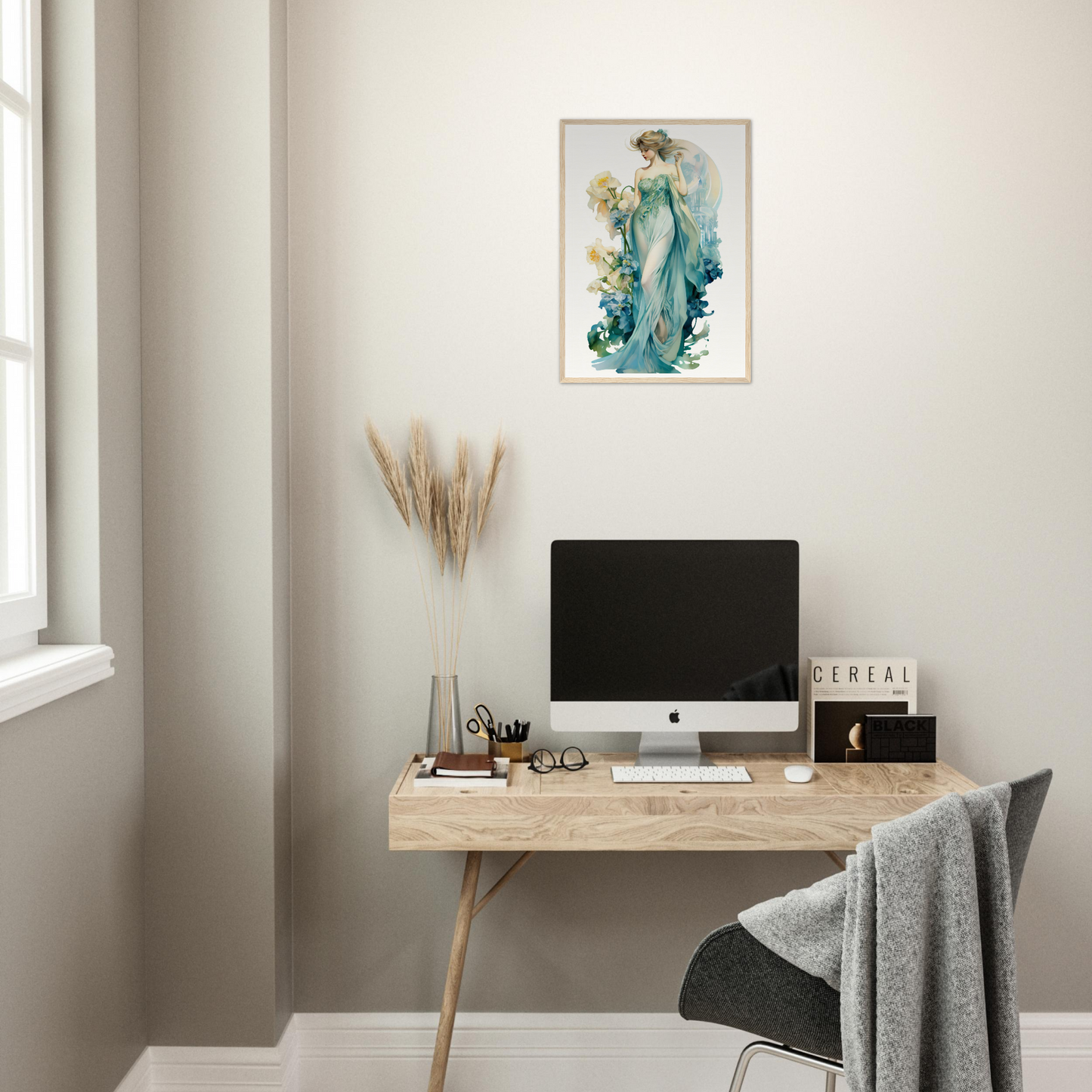 Minimalist wooden desk with a computer monitor and office accessories.