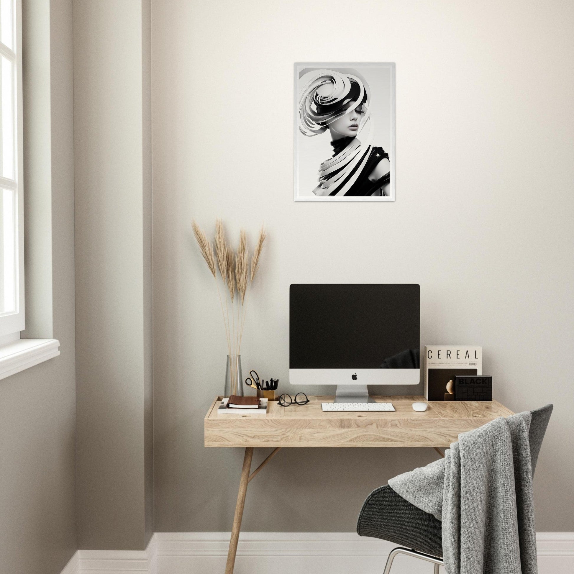 Minimalist wooden desk with a computer monitor and office accessories.