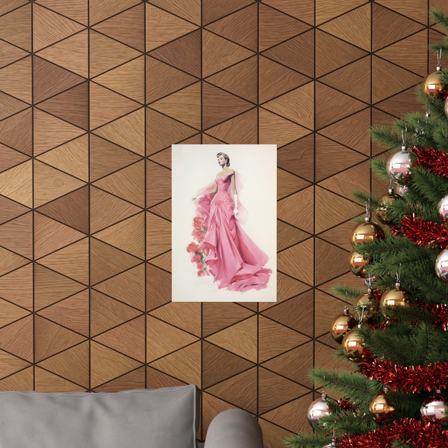 A christmas tree with a pink dress hanging on it