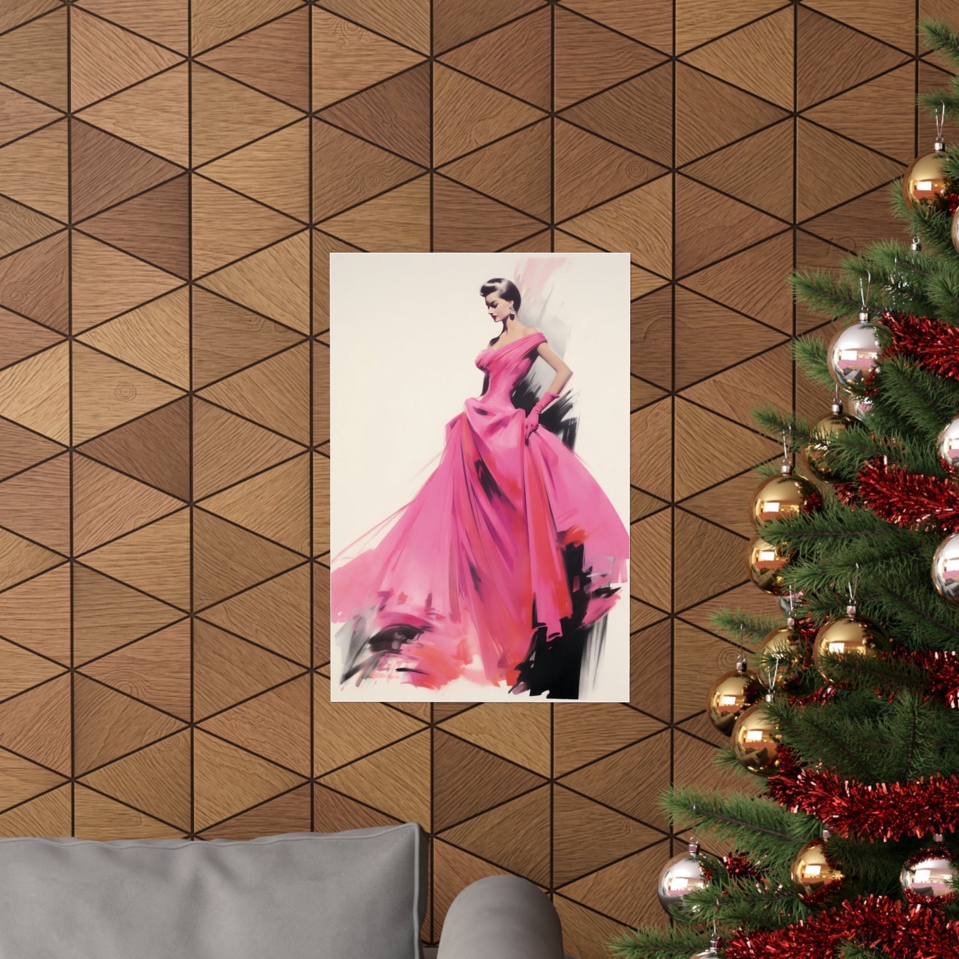 A christmas tree with a pink dress hanging on it