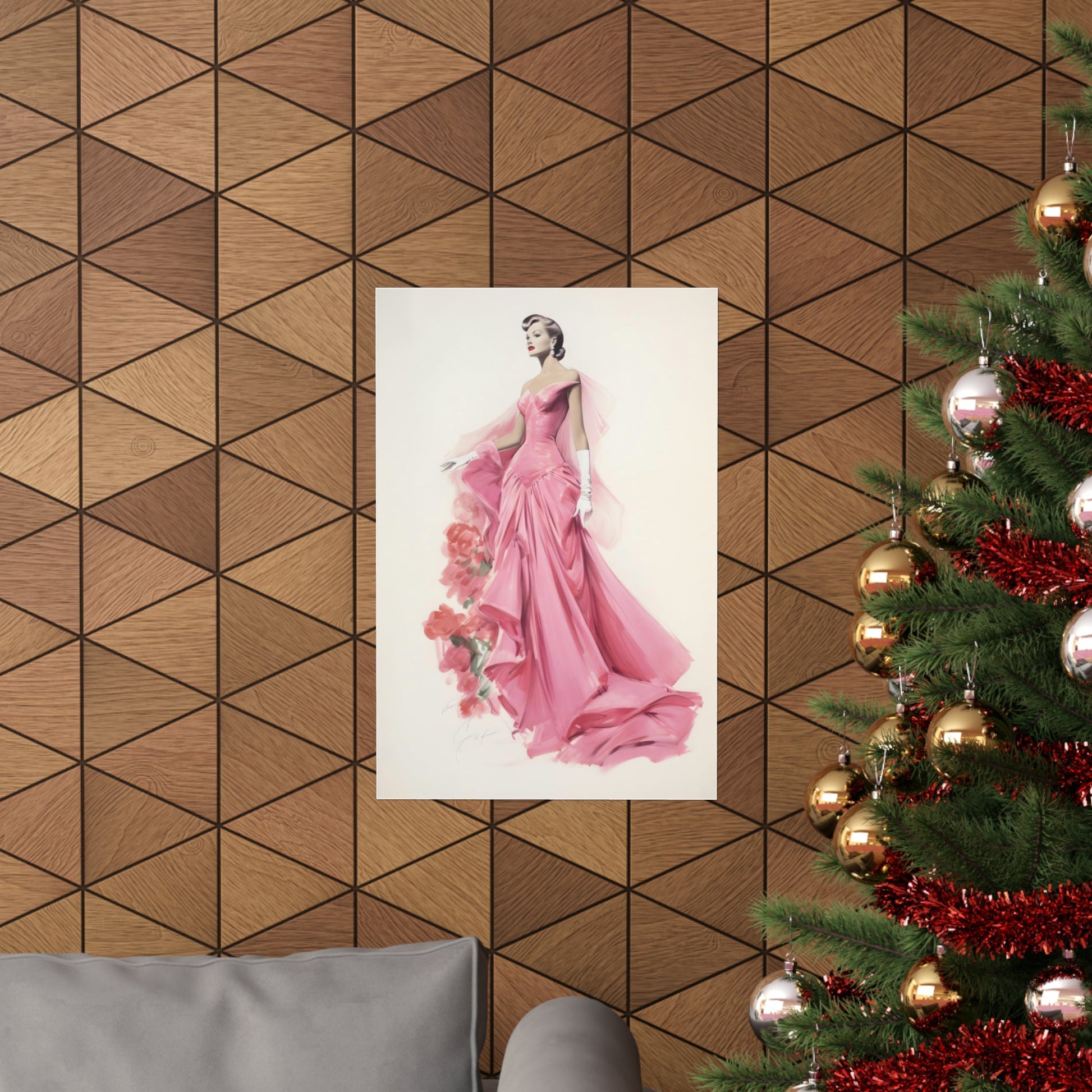 A christmas tree with a pink dress hanging on it