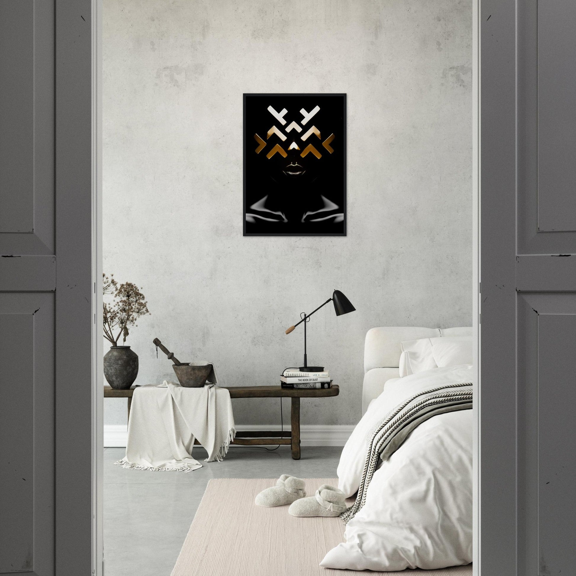 Minimalist bedroom with a striking black and gold abstract artwork on the wall.