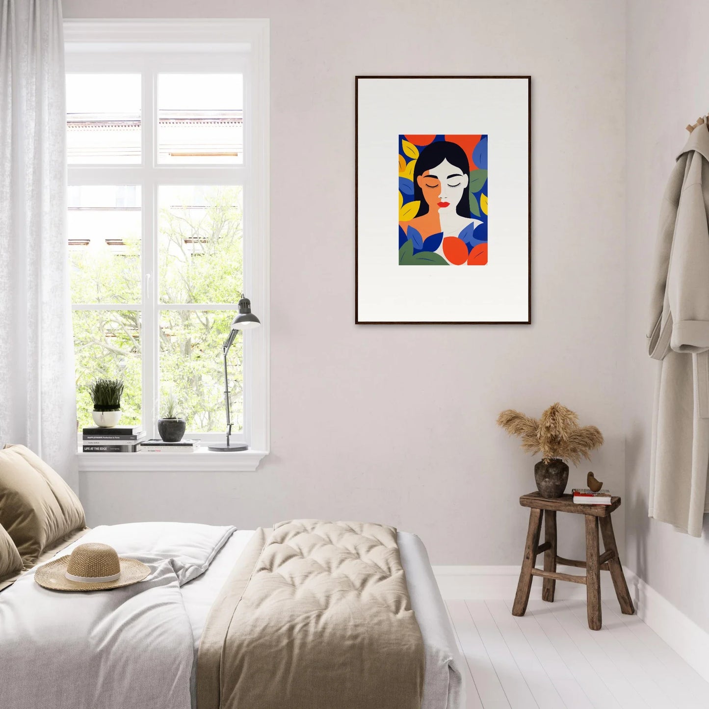 Colorful abstract portrait painting framed for stylish room decor on a white wall