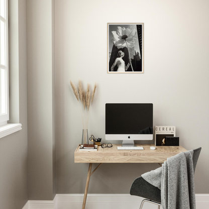 A desk with a computer and a plant