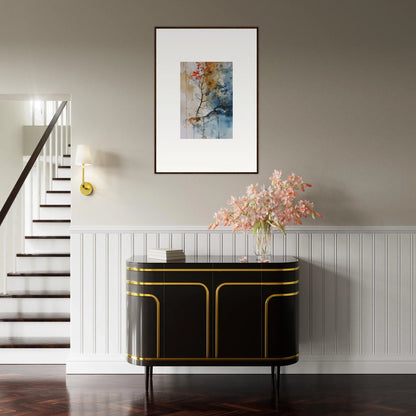 Elegant black and gold sideboard enhancing room decor with Spectrum Spoon art nearby