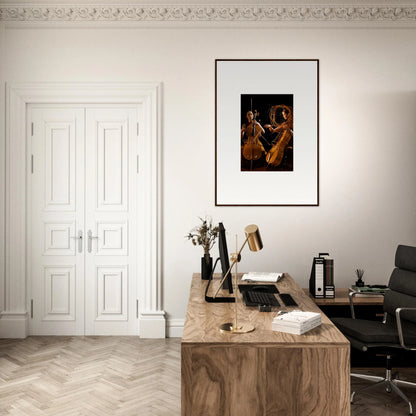 Elegant home office with wooden desk, framed wall art, and stylish room decor