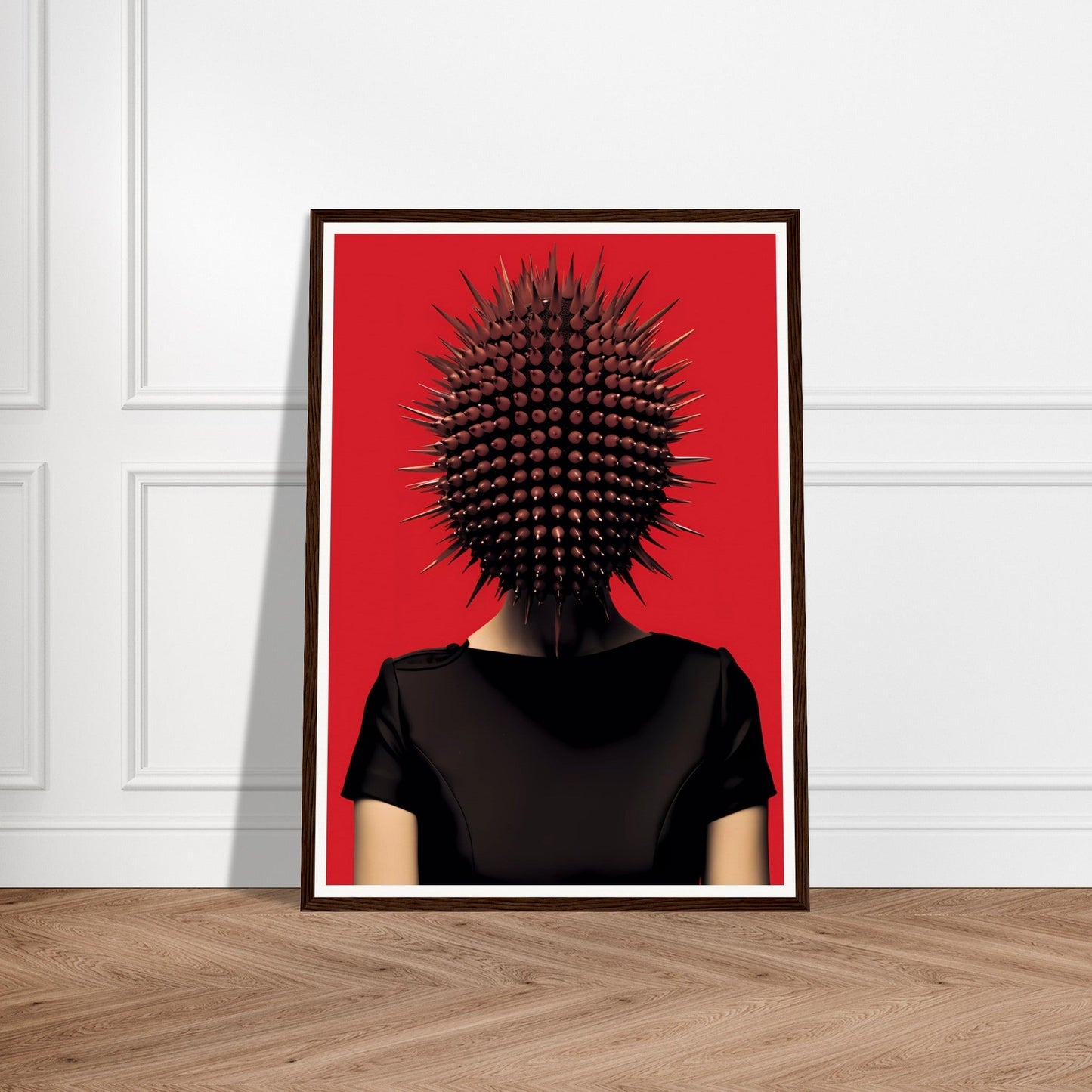 Surreal portrait with a spiky spherical shape replacing the head atop a black-clothed torso against a red background.