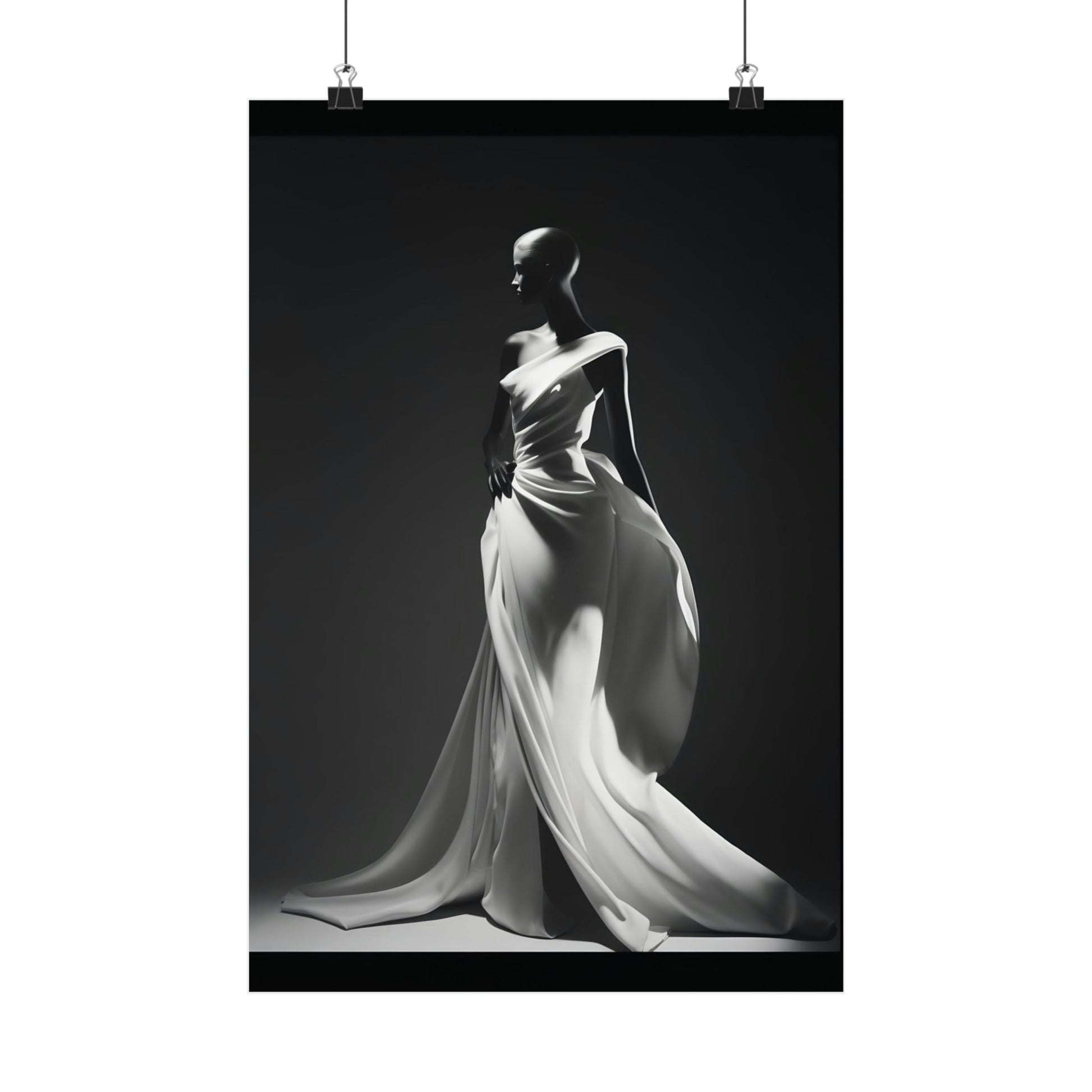 Elegant black and white photograph of a figure in a flowing white gown with dramatic draping.