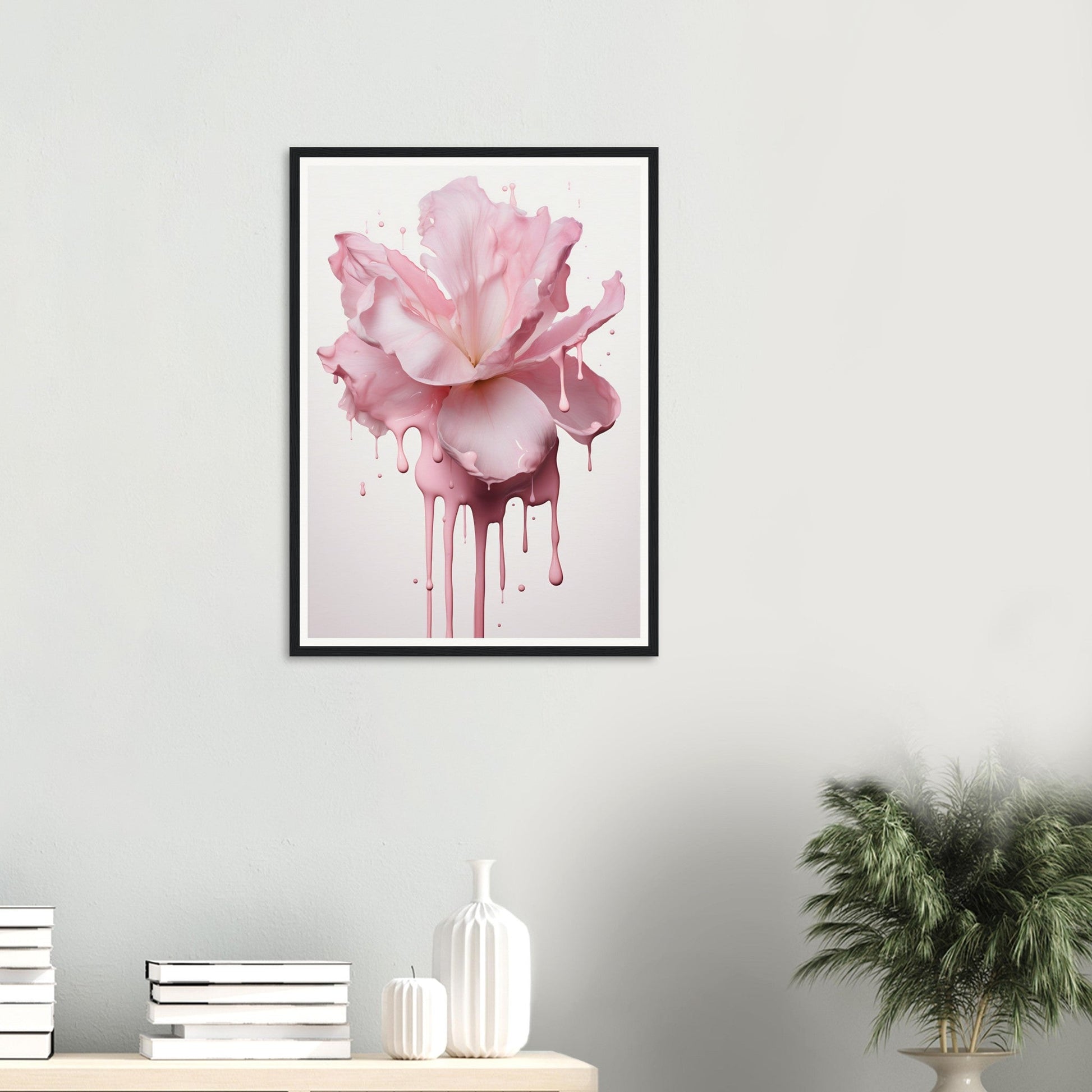 Framed artwork depicting a pink rose with paint dripping down.