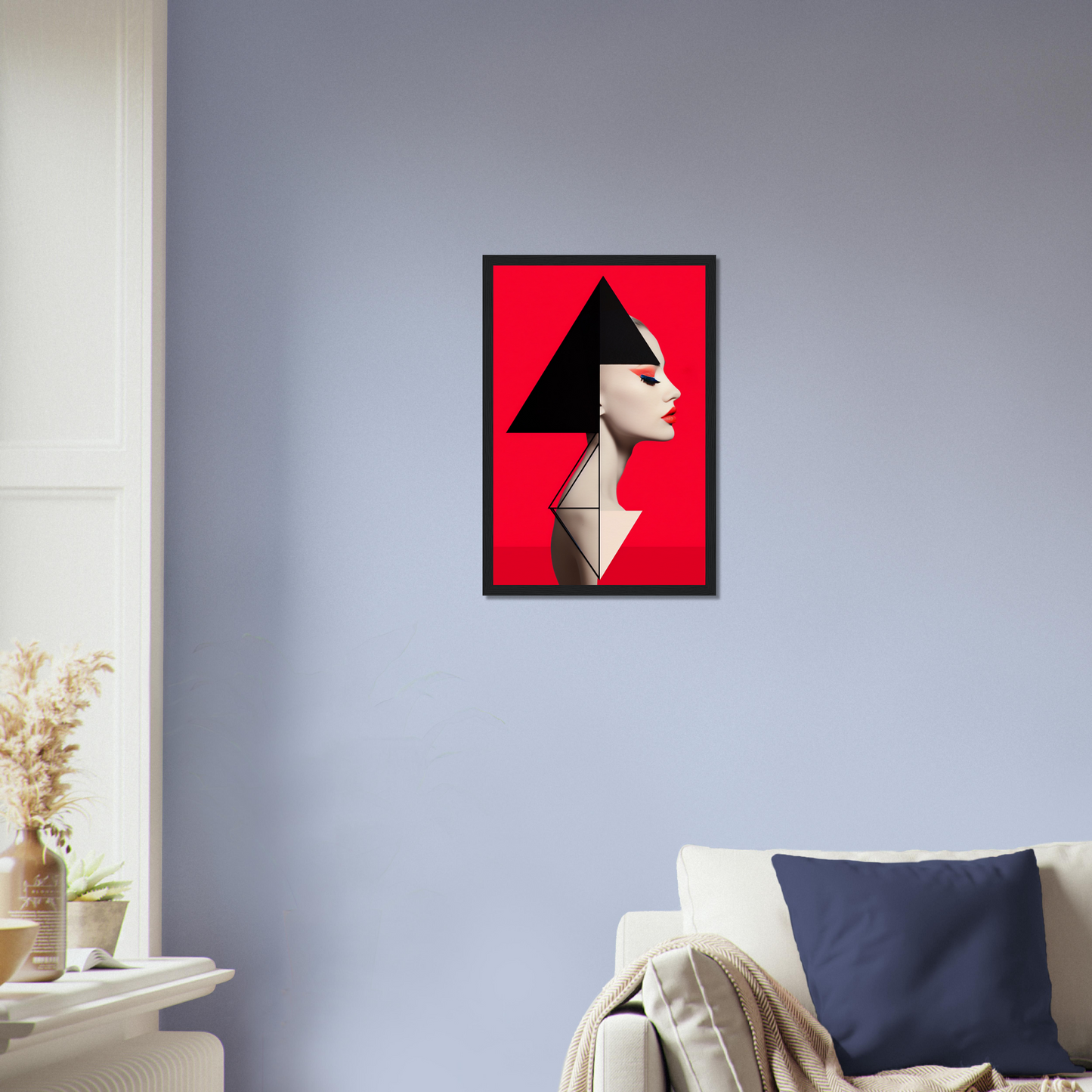 Framed artwork featuring a stylized profile portrait with geometric elements on a red background.