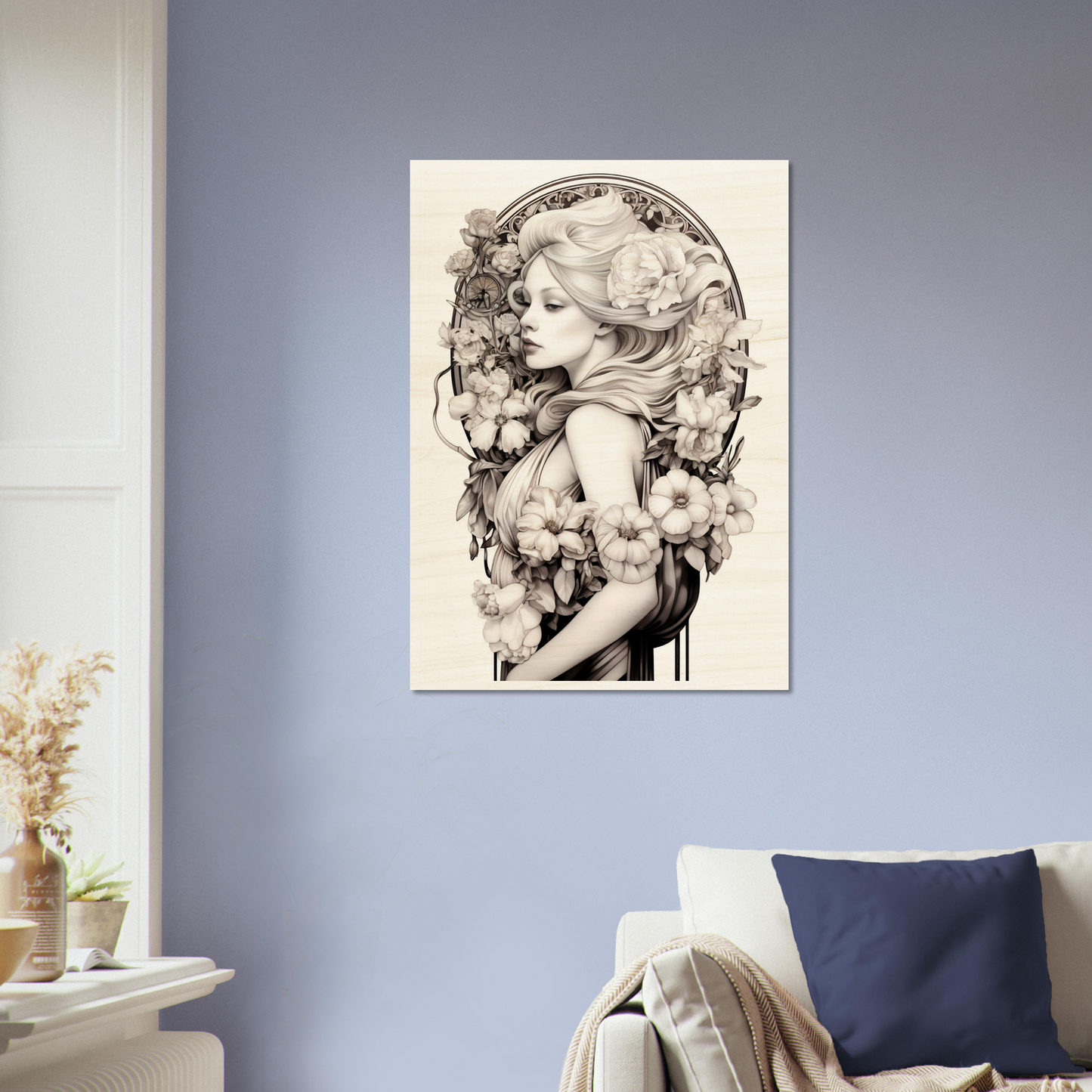 Framed artwork depicting a woman’s profile surrounded by floral elements in a black and white style.